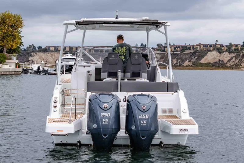 Slide: The Image of 2023 Jeanneau Leader 9.0 WA boat with dual Yamaha 250 V6 engines on water. - 6