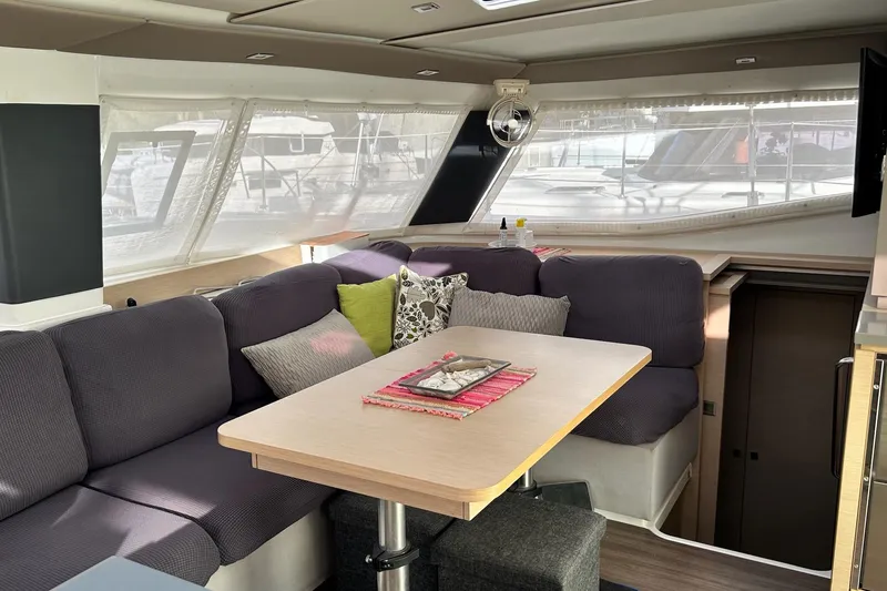 Slide: The Image of Interior of 2019 Fountaine Pajot Helia 44 Evolution catamaran with cozy seating and dining area. - 14