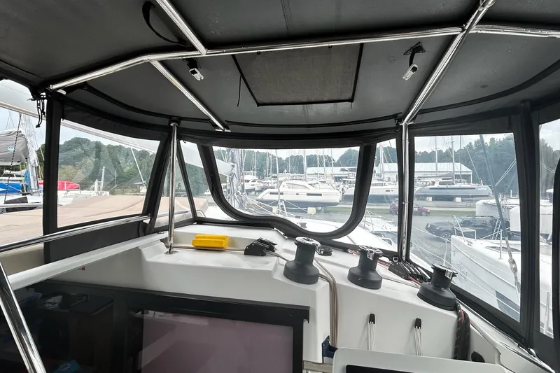 Slide: The Image of Interior view of 2019 Fountaine Pajot Helia 44 Evolution catamaran cockpit at marina. - 24