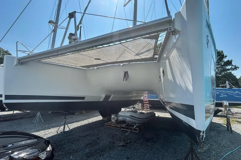 Slide: The Image of 2019 Fountaine Pajot Helia 44 Evolution catamaran on dry dock, side view. - 3