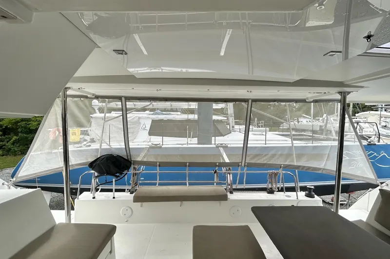 Slide: The Image of 2019 Fountaine Pajot Helia 44 Evolution catamaran interior with marina view. - 33