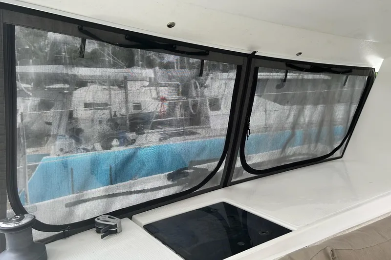 Slide: The Image of Interior view of 2019 Fountaine Pajot Helia 44 Evolution catamaran with mesh-covered windows. - 35