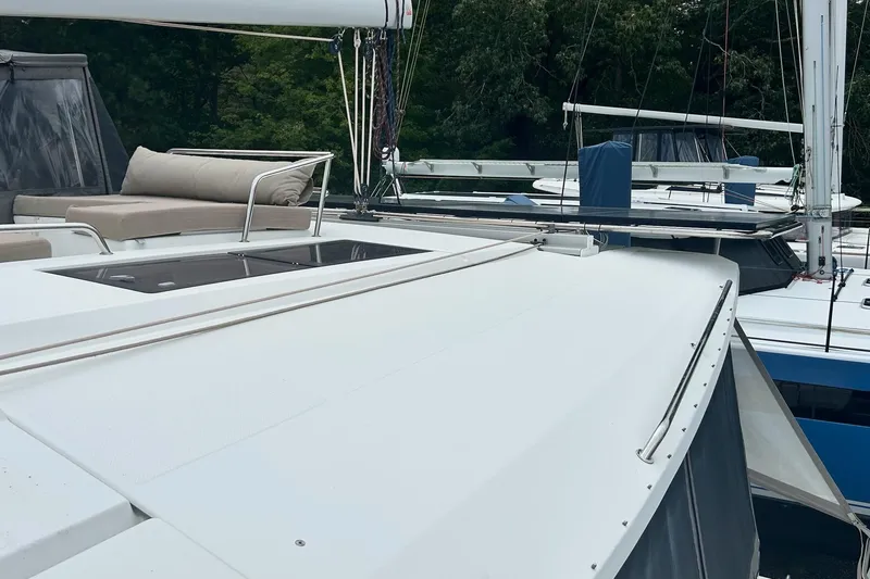 Slide: The Image of 2019 Fountaine Pajot Helia 44 Evolution catamaran with spacious deck and seating area. - 44