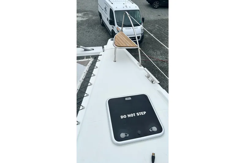 Slide: The Image of 2019 Fountaine Pajot Helia 44 Evolution catamaran deck with "Do Not Step" sign. - 50