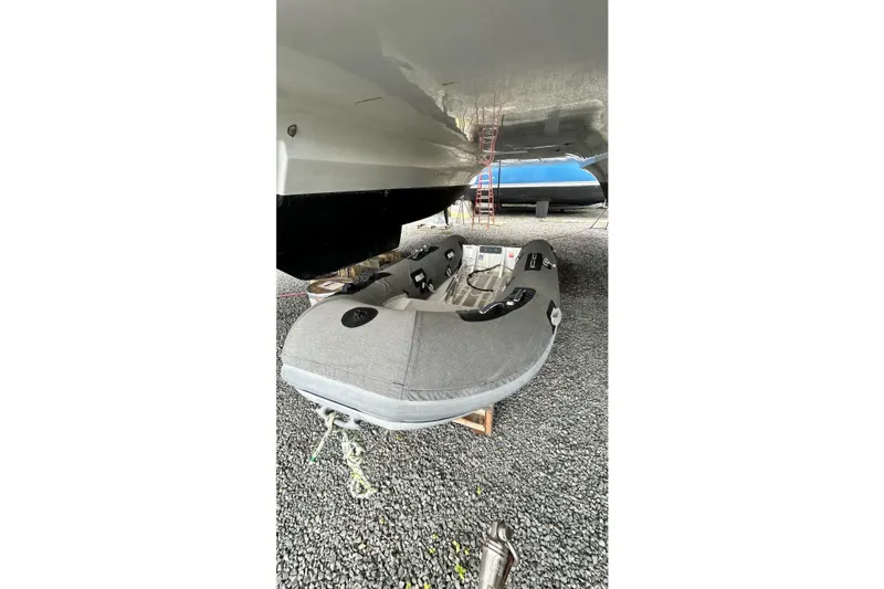 Slide: The Image of 2019 Fountaine Pajot Helia 44 Evolution catamaran with inflatable dinghy underneath. - 55