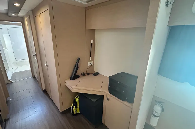 Slide: The Image of Interior of 2019 Fountaine Pajot Helia 44 Evolution yacht, featuring a modern workspace. - 56