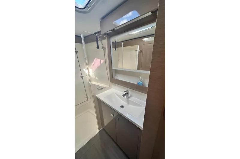 Slide: The Image of Modern bathroom in 2019 Fountaine Pajot Helia 44 Evolution yacht, featuring sleek sink and shower. - 61