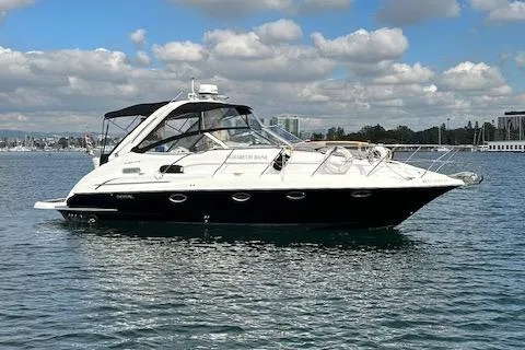 The Image of 2006 Doral Elegante boat on calm water under a partly cloudy sky. - 0