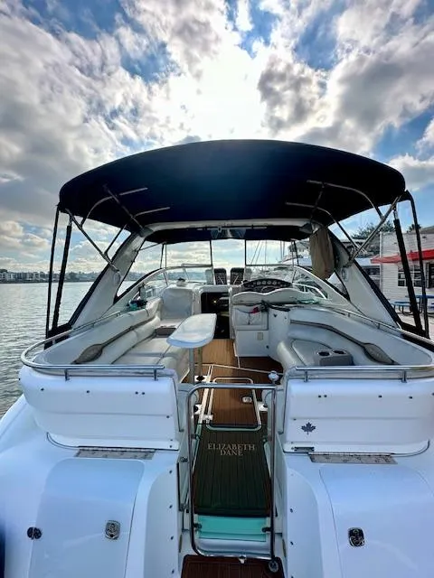 Slide: The Image of 2006 Doral Elegante boat with canopy, docked on a sunny day. - 10