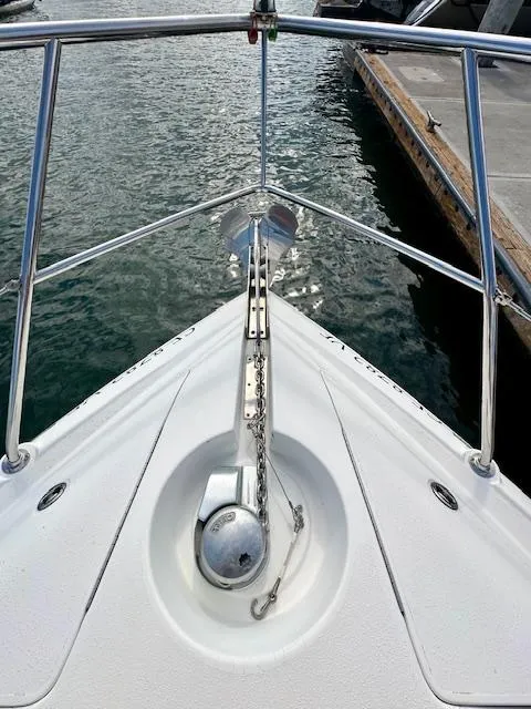Slide: The Image of Bow of 2006 Doral Elegante boat with anchor, docked at marina. - 12