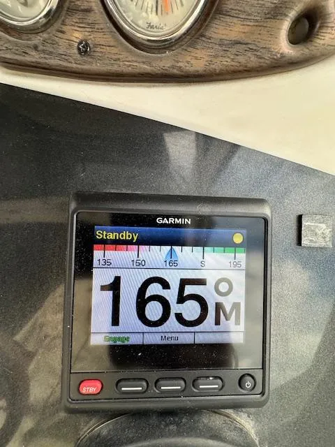 Slide: The Image of Garmin navigation display on 2006 Doral Elegante boat, showing heading of 165 degrees. - 15