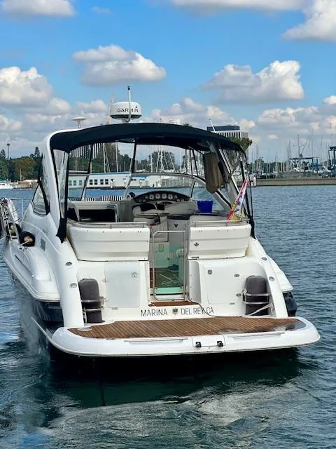 Slide: The Image of 2006 Doral Elegante boat docked at Marina Del Rey under a partly cloudy sky. - 3