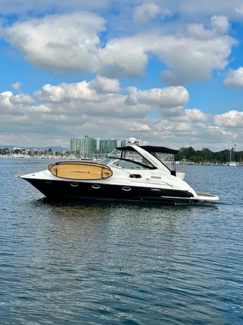 Slide: The Image of 2006 Doral Elegante yacht on calm water under a partly cloudy sky. - 4