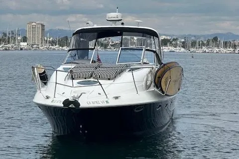 Slide: The Image of 2006 Doral Elegante boat on water with cityscape background. - 6