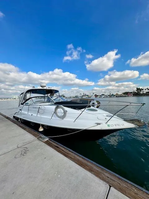 Slide: The Image of 2006 Doral Elegante boat docked by the waterfront under a blue sky. - 8