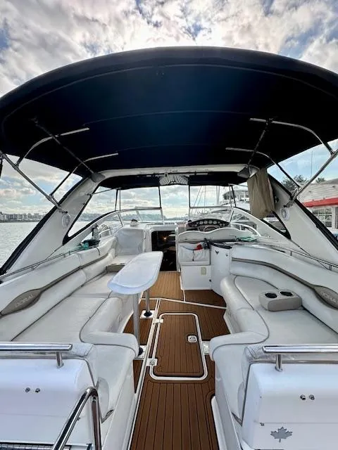 Slide: The Image of 2006 Doral Elegante yacht interior with white seating and wooden flooring. - 9