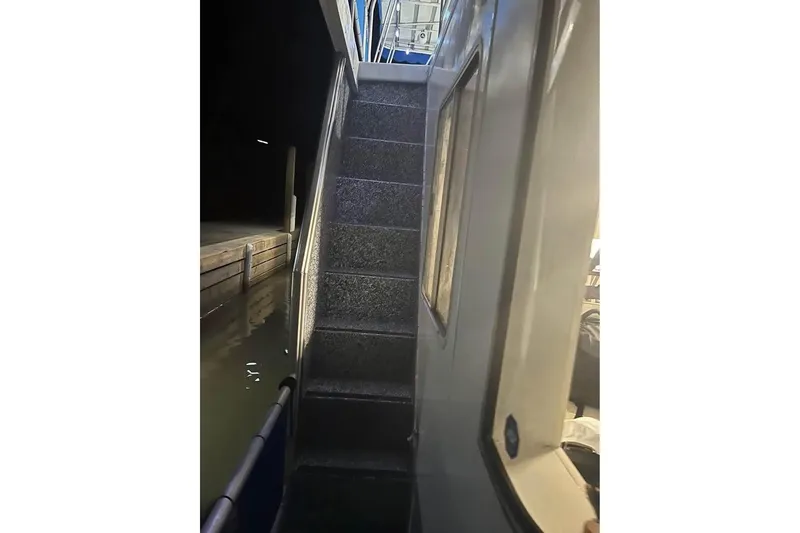 Slide: The Image of Staircase on a 1999 Sharpe houseboat, docked at night. - 7