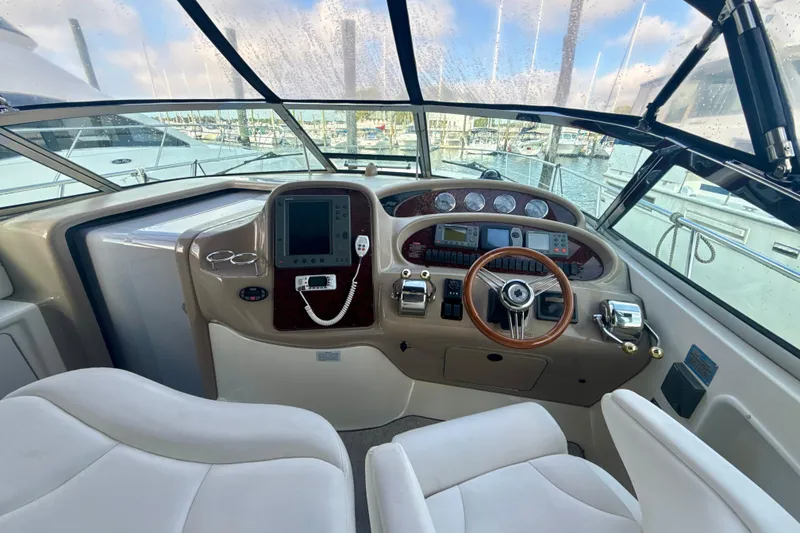Slide: The Image of Helm of 2004 Sea Ray 380 Sundancer with modern controls and panoramic view. - 17