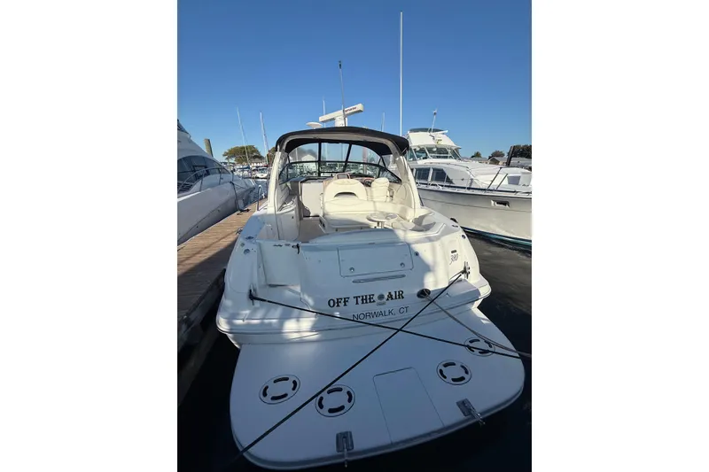 Slide: The Image of 2004 Sea Ray 380 Sundancer docked at marina, rear view. - 2