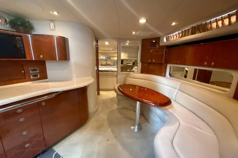 Slide: The Image of Luxurious interior of 2004 Sea Ray 380 Sundancer yacht with elegant seating and cabinetry. - 20
