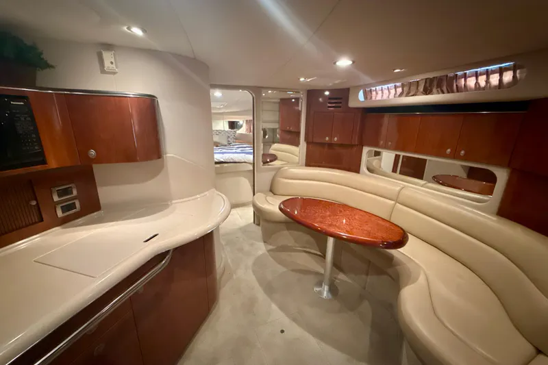 Slide: The Image of Luxurious interior of 2004 Sea Ray 380 Sundancer yacht with elegant seating and wood finishes. - 21