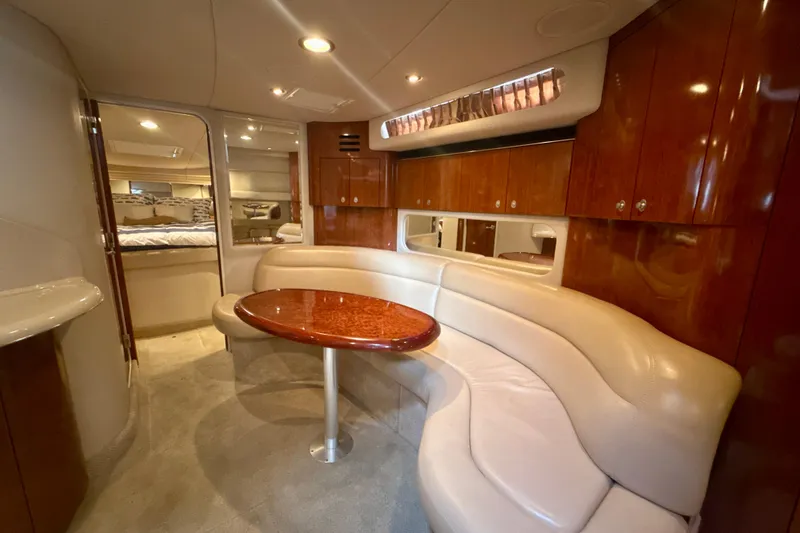 Slide: The Image of Luxurious interior of 2004 Sea Ray 380 Sundancer yacht with elegant seating and wood finishes. - 22