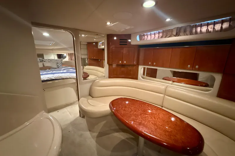 Slide: The Image of Luxurious interior of 2004 Sea Ray 380 Sundancer yacht with elegant seating and wood finishes. - 23