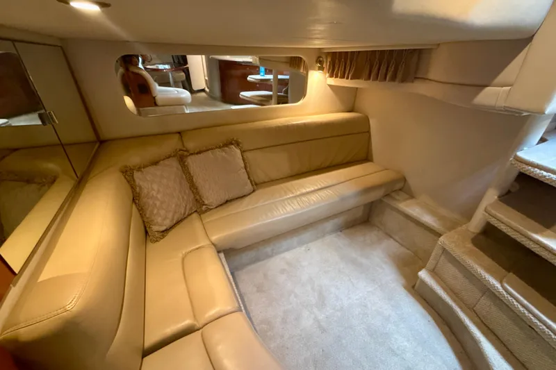 Slide: The Image of Luxurious interior of 2004 Sea Ray 380 Sundancer with beige leather seating. - 28