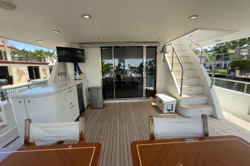 Slide: The Image of 2006 Cheoy Lee 84 Bravo yacht cruising on a scenic waterway. - 14