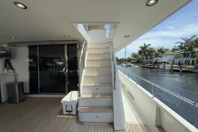 Slide: The Image of 2006 Cheoy Lee 84 Bravo yacht cruising on a sunny day with scenic waterfront views. - 19