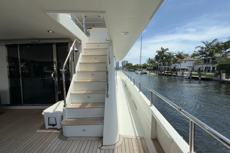 Slide: The Image of Luxurious 2006 Cheoy Lee 84 Bravo yacht with sun loungers, docked by palm trees. - 20