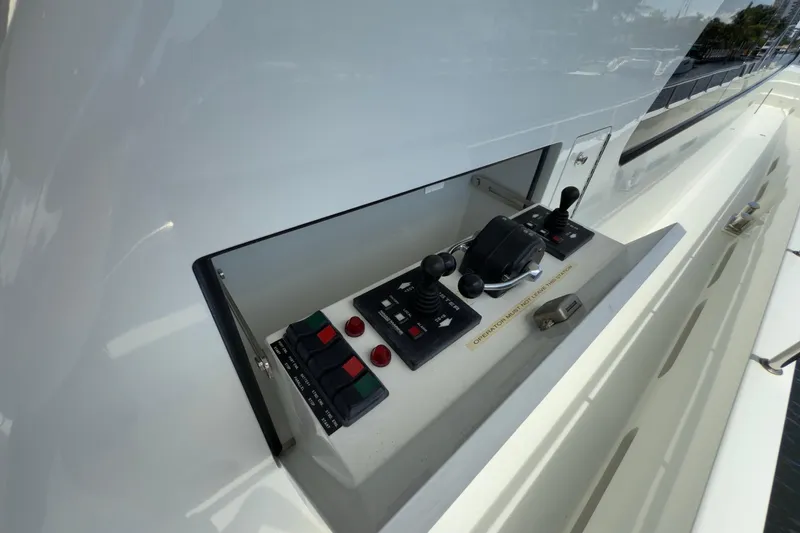 Slide: The Image of Luxury deck of 2006 Cheoy Lee 84 Bravo yacht with dining area and American flag. - 23