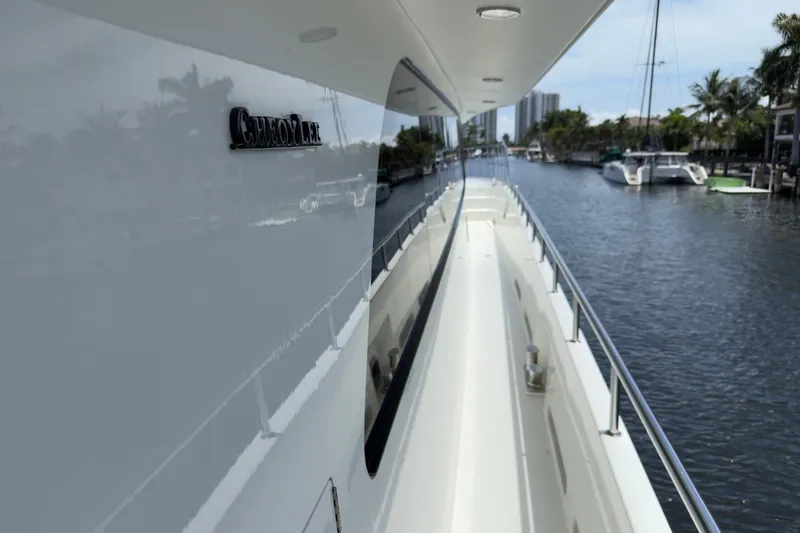 Slide: The Image of Luxurious 2006 Cheoy Lee 84 Bravo yacht deck with seating and dining area. - 25