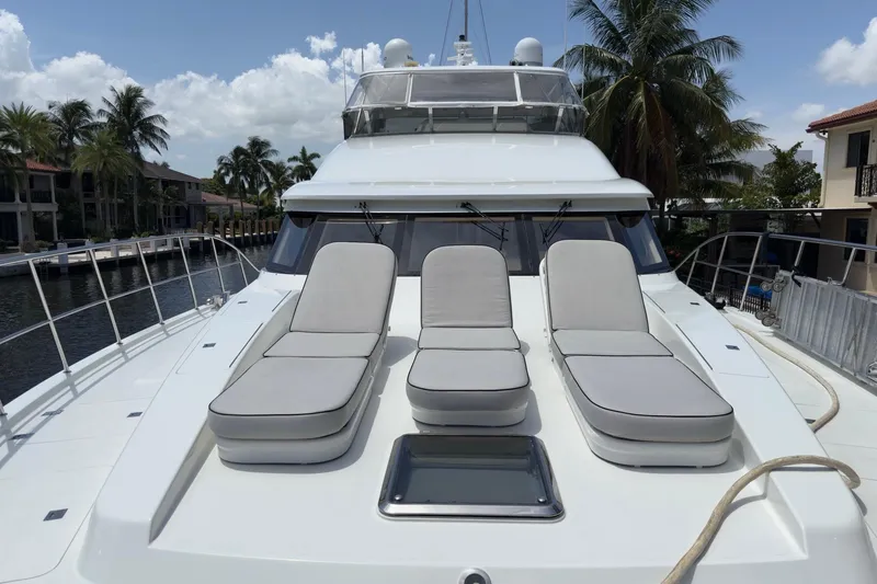 Slide: The Image of Luxurious 2006 Cheoy Lee 84 Bravo yacht interior with bar, seating, and elegant wood finishes. - 31