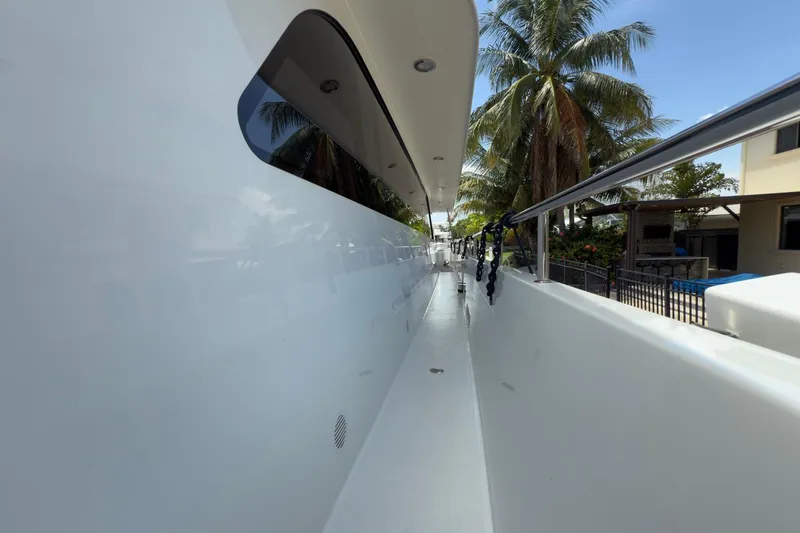 Slide: The Image of Luxurious wooden staircase inside 2006 Cheoy Lee 84 Bravo yacht, featuring elegant design and lighting. - 37