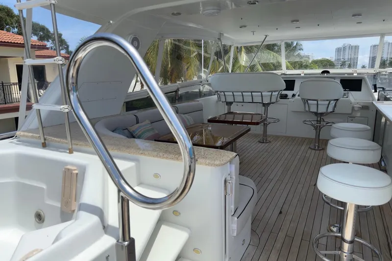 Slide: The Image of Luxurious 2006 Cheoy Lee 84 Bravo yacht bedroom with elegant wood finishes and modern decor. - 46