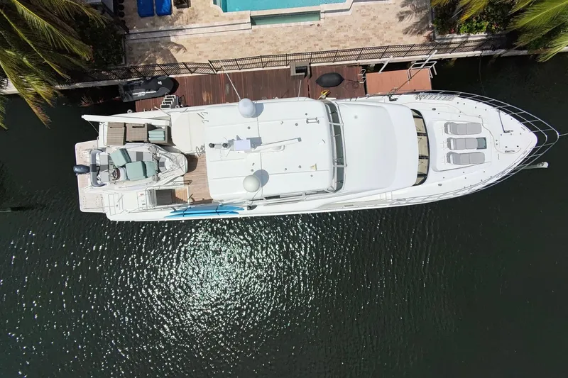 Slide: The Image of 2006 Cheoy Lee 84 Bravo yacht on water, city skyline in background. - 5