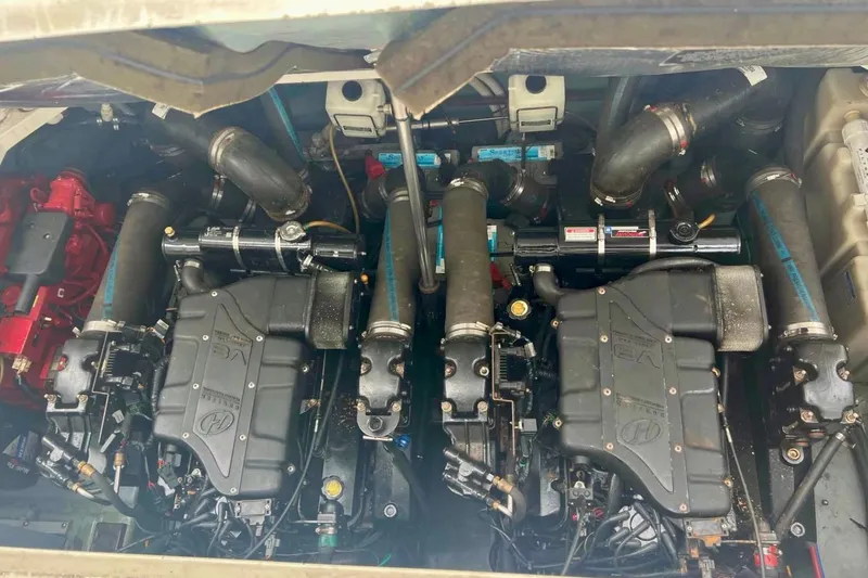 Slide: The Image of Engine compartment of a 2000 Sea Ray 340 Sundancer boat, showcasing dual engines. - 11