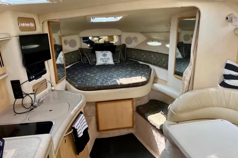Slide: The Image of Interior of 2000 Sea Ray 340 Sundancer yacht with cozy bed and kitchenette. - 9