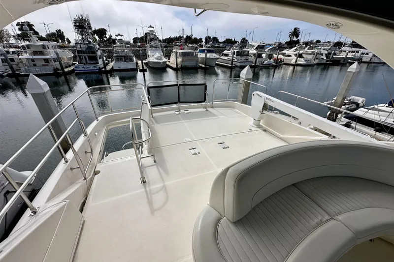 Slide: The Image of 2004 Meridian 580 Pilothouse yacht deck overlooking marina with multiple boats docked. - 111