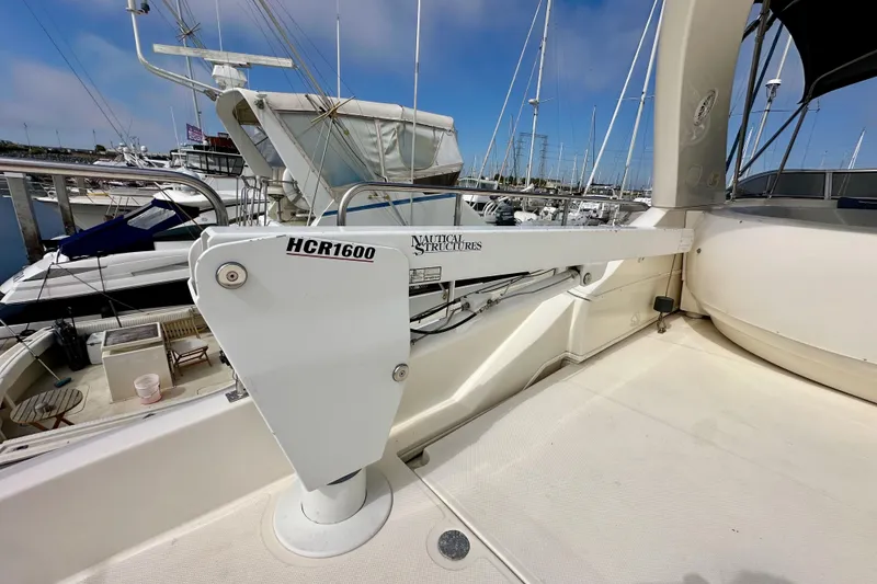 Slide: The Image of 2004 Meridian 580 Pilothouse yacht with HCR1600 crane at marina. - 116