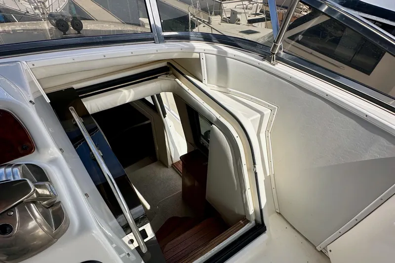 Slide: The Image of 2004 Meridian 580 Pilothouse interior view with stairs and sleek design. - 123
