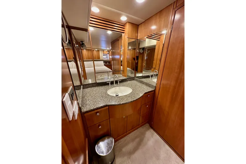 Slide: The Image of Luxurious bathroom in 2004 Meridian 580 Pilothouse yacht with wood cabinetry and granite countertop. - 135