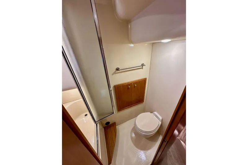 Slide: The Image of Bathroom interior of 2004 Meridian 580 Pilothouse yacht, featuring shower and toilet. - 136