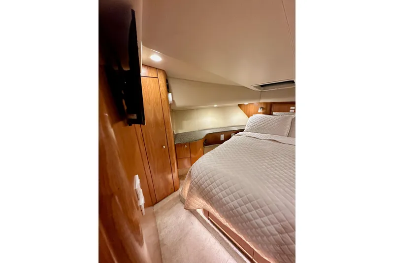 Slide: The Image of Luxurious cabin interior of 2004 Meridian 580 Pilothouse yacht with cozy bedding. - 147