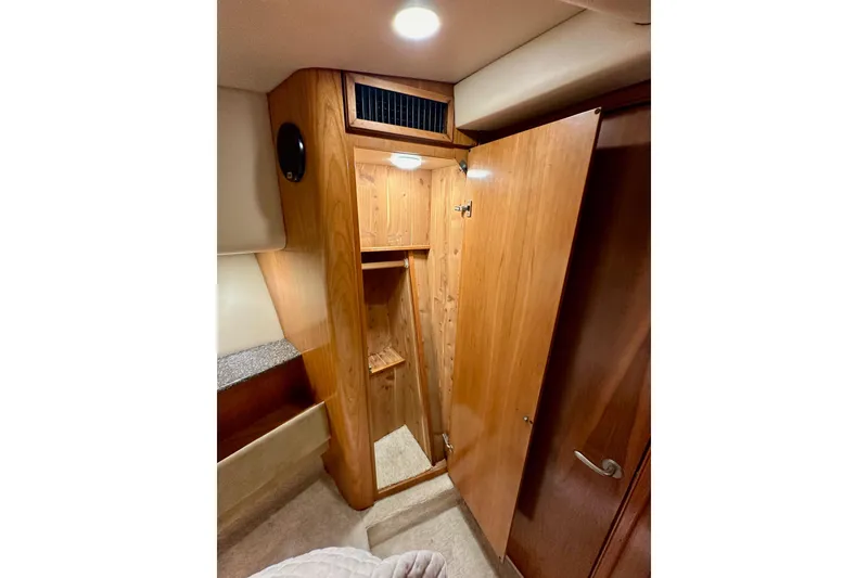 Slide: The Image of Wooden closet interior in 2004 Meridian 580 Pilothouse yacht cabin. - 152