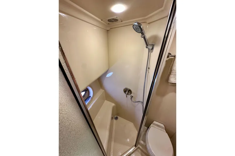 Slide: The Image of Compact bathroom in 2004 Meridian 580 Pilothouse yacht with shower and toilet. - 157