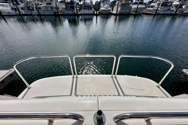 Slide: The Image of View from 2004 Meridian 580 Pilothouse yacht overlooking marina with docked boats. - 166