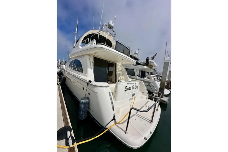 Slide: The Image of 2004 Meridian 580 Pilothouse yacht docked at marina, rear view. - 18