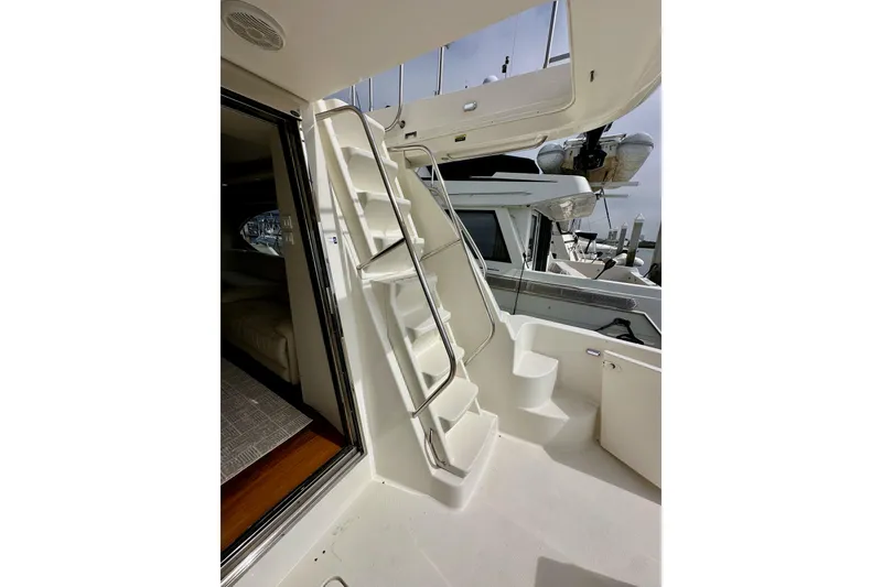 Slide: The Image of Staircase on 2004 Meridian 580 Pilothouse yacht, leading to upper deck. - 25